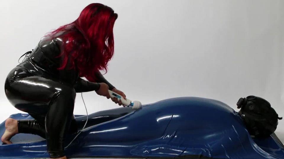 Mistress Wearing Latex Torturing Trapped Slave in Rubber Vacuum Bed